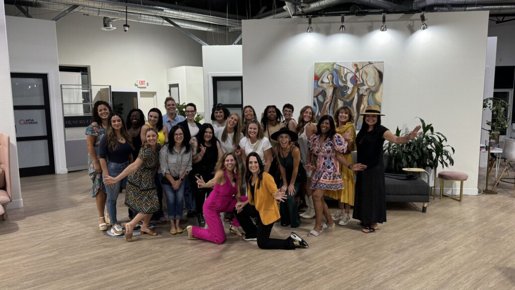 Group photo of guests with Ati G. and Lisa Chastain in front of the group.